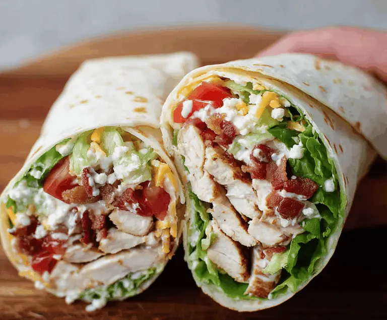 Delicious Chicken Ranch Wraps filled with grilled chicken, crisp lettuce, fresh tomatoes, and creamy ranch dressing in a soft tortilla.