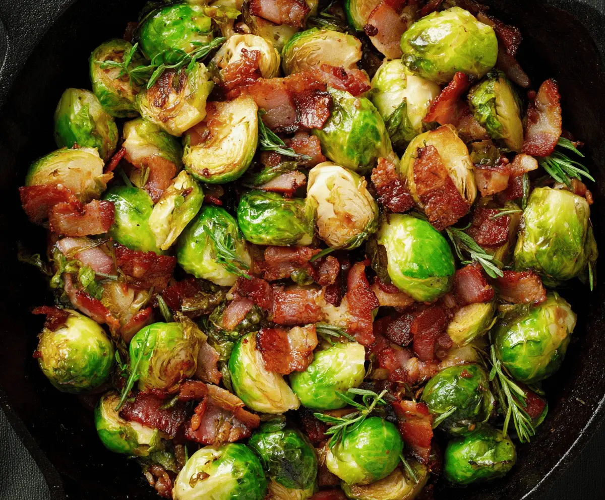 Golden roasted Brussels sprouts topped with crispy bacon, served as a delicious and savory side dish.