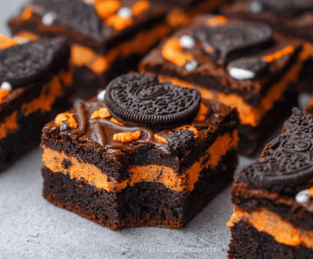 Delicious Halloween Oreo Brownies with festive Halloween decorations and colorful candy toppings