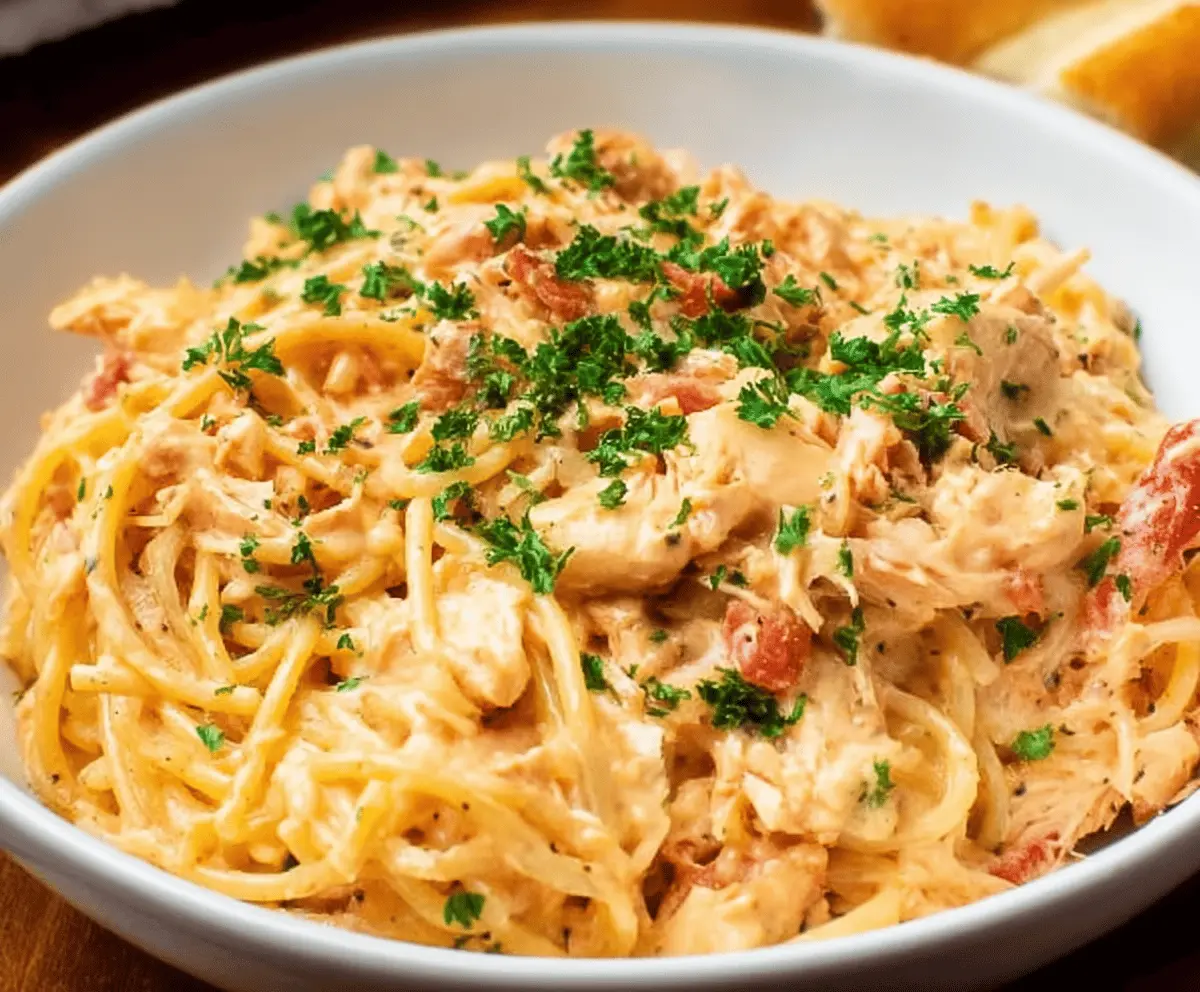Delicious homemade Chicken Spaghetti with creamy sauce and melted cheese, perfect for family dinner.
