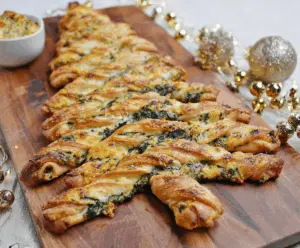 Festive Christmas Tree Spinach Dip Breadsticks with melted cheese and fresh spinach for holiday appetizer