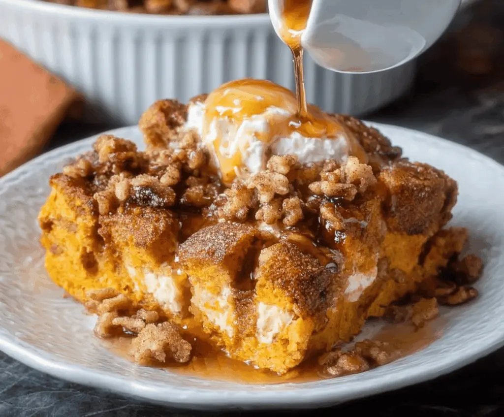 Delicious Pumpkin Spice French Toast Casserole topped with whipped cream and cinnamon for a cozy breakfast