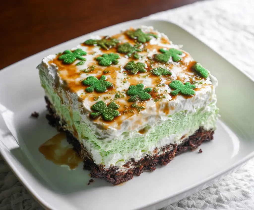 Delicious St. Patrick's Day Shamrock Lasagna Dessert with vibrant green layers and festive decoration.