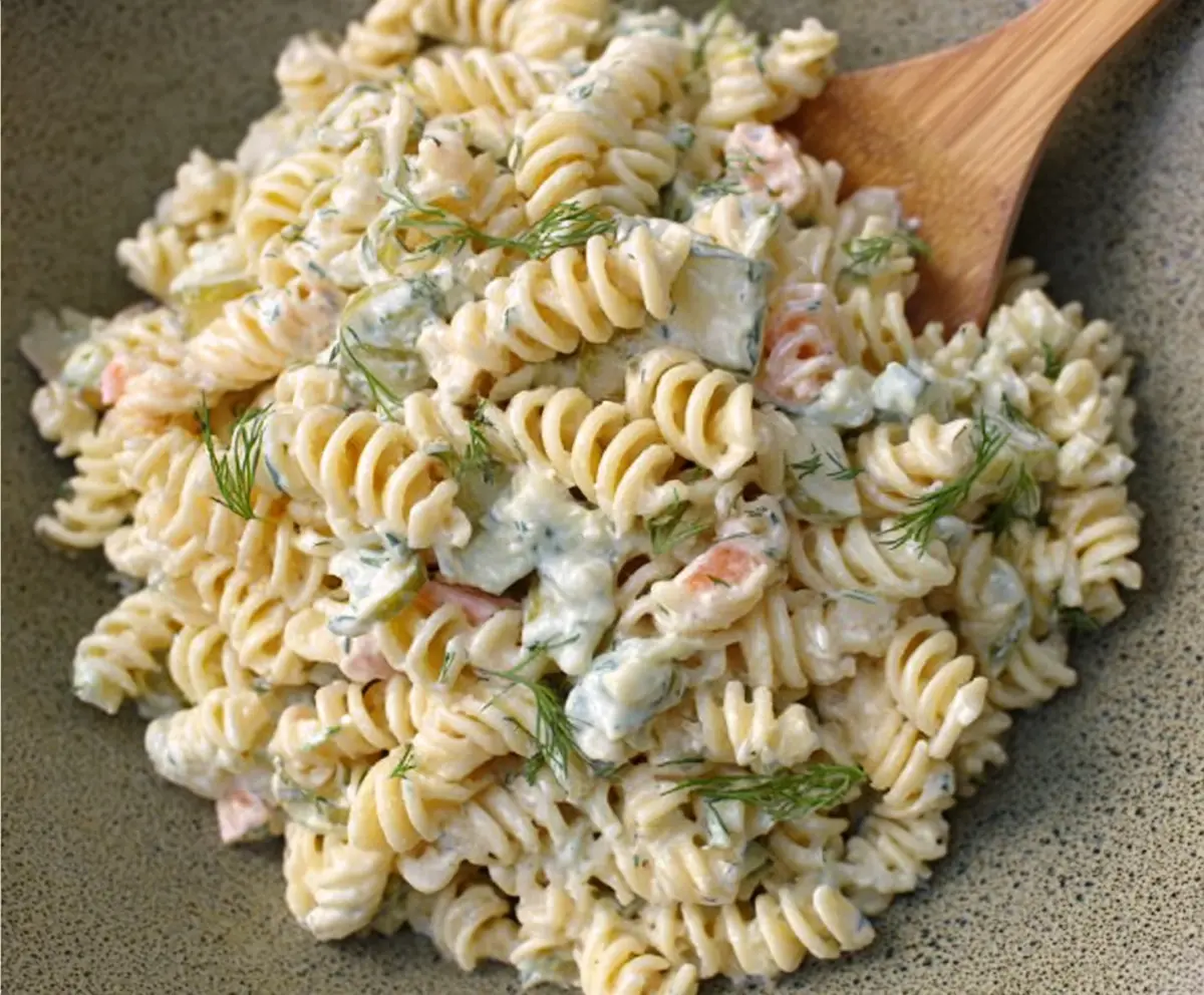 Delicious Dill Pickle Pasta Salad with fresh herbs and vibrant vegetables.